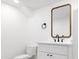 Simple bathroom with a white vanity and modern mirror at 2355 Ivanhoe St, Denver, CO 80207