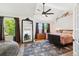 Spacious bedroom featuring a large window for ample natural light and comfortable furnishings at 5704 W Atlantic Pl, Lakewood, CO 80227