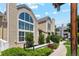Charming townhome exterior featuring large windows, well-kept landscaping, and a welcoming pathway at 5704 W Atlantic Pl, Lakewood, CO 80227