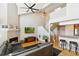 Welcoming living area with hardwood floors, fireplace, large windows, and comfortable seating at 5704 W Atlantic Pl, Lakewood, CO 80227