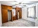 Bedroom featuring built-in wood closets and a ceiling fan with light, offering ample storage at 254 Donna St, Fort Lupton, CO 80621