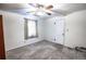 Bright bedroom with large window, and light-colored walls and carpet at 254 Donna St, Fort Lupton, CO 80621