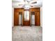 This bedroom has built-in closets with center window and neutral carpet at 254 Donna St, Fort Lupton, CO 80621