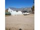 View of a charming home featuring a carport and ample parking on a gravel drive at 254 Donna St, Fort Lupton, CO 80621