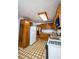 Functional kitchen featuring wood cabinets and drawers, a refrigerator, and a gas range at 254 Donna St, Fort Lupton, CO 80621