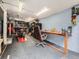 Organized garage featuring a workspace, a motorcycle lift, and storage at 6837 S Brook Forest Rd, Evergreen, CO 80439