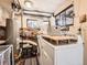 Functional laundry room with washer, dryer, and brick foundation visible at 6837 S Brook Forest Rd, Evergreen, CO 80439