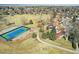 Wonderful aerial of community including a tennis court, recreation area and sidewalks at 7761 Everett Way, Arvada, CO 80005