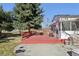 Enjoy outdoor relaxation on this wood deck, perfect for entertaining, with great backyard views at 7761 Everett Way, Arvada, CO 80005