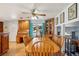 Bright dining area with a large wooden table, perfect for Gathering meals and gatherings at 7761 Everett Way, Arvada, CO 80005