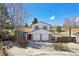 Inviting two-story home with a two-car garage, brick facade, and lovely architectural design at 7761 Everett Way, Arvada, CO 80005