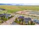 Houses in a community are by a scenic pond, and are backed by mountains and open space at 9570 Kendrick Way, Arvada, CO 80007