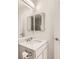 Bright bathroom featuring a white vanity with chrome fixtures at 400 Smith Cir, Erie, CO 80516