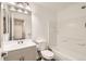 A bright bathroom with a sink, toilet, and shower-tub combo at 400 Smith Cir, Erie, CO 80516