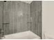 Clean and modern bathroom with a tiled shower and white fixtures at 400 Smith Cir, Erie, CO 80516