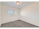 This is a simple, bright bedroom with a window and carpet at 400 Smith Cir, Erie, CO 80516