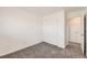 Bedroom with neutral carpet, a closet and a white door leading to another room at 400 Smith Cir, Erie, CO 80516