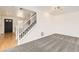 Bright entryway with carpeted stairs and wood-style flooring at 400 Smith Cir, Erie, CO 80516