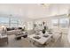 Bright, open-concept living and dining area with neutral tones and lots of natural light at 400 Smith Cir, Erie, CO 80516