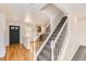 Carpeted staircase with a white railing leading to the upper level of the home at 400 Smith Cir, Erie, CO 80516