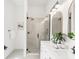 Beautiful bathroom boasts a glass shower, double vanity, and stylish fixtures at 230 E Ellsworth Ave, Denver, CO 80209