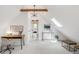 Sunlit bedroom with vaulted ceilings features modern furnishings, skylight and en suite bathroom view at 230 E Ellsworth Ave, Denver, CO 80209