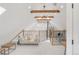 Bonus room/loft features wood beams, bright lighting, skylight and exposed brick accent at 230 E Ellsworth Ave, Denver, CO 80209