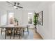 Bright dining room with modern furniture, natural light, and greenery, perfect for cozy gatherings at 230 E Ellsworth Ave, Denver, CO 80209