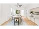 Elegant dining room with a modern table setting, stylish decor, and ample natural light at 230 E Ellsworth Ave, Denver, CO 80209