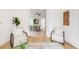 An open dining room featuring modern furnishings and hardwood floors at 230 E Ellsworth Ave, Denver, CO 80209