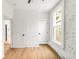 Inviting room with hardwood floors, modern doors, and natural light, ideal for creating your dream space at 230 E Ellsworth Ave, Denver, CO 80209