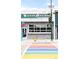 Sweet Action Ice Cream shop exterior featuring a colorful crosswalk and clear signage at 230 E Ellsworth Ave, Denver, CO 80209