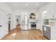 Renovated kitchen features stainless steel appliances, quartz countertops, and ample storage at 230 E Ellsworth Ave, Denver, CO 80209