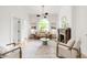 Inviting living room featuring natural light, neutral decor, and an ornate fireplace at 230 E Ellsworth Ave, Denver, CO 80209