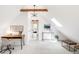 Bright office with skylight, desk and view into a bedroom through the doorway at 230 E Ellsworth Ave, Denver, CO 80209