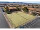 Aerial view of tennis courts surrounded by a parking lot and apartment buildings at 5102 Williams Fork Trl # 201, Boulder, CO 80301