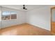 This room features a ceiling fan, hardwood floors, and natural light from the window at 5102 Williams Fork Trl # 201, Boulder, CO 80301