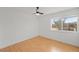 Bright and airy bedroom with hardwood floors and a large window offering natural light and a view at 5102 Williams Fork Trl # 201, Boulder, CO 80301