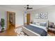 A well-lit bedroom features a white platform bed, wood floors, and modern art pieces, offering a serene ambiance at 5102 Williams Fork Trl # 201, Boulder, CO 80301