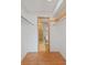 Walk-in closet with hardwood floors and built in shelving leading to the bathroom at 5102 Williams Fork Trl # 201, Boulder, CO 80301