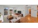 Bright living room featuring hardwood floors, a sliding glass door to the balcony, and modern furnishings at 5102 Williams Fork Trl # 201, Boulder, CO 80301