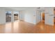 Spacious living room boasts hardwood floors, a sliding glass door to the balcony, and ample natural light at 5102 Williams Fork Trl # 201, Boulder, CO 80301