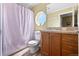 Updated bathroom features wood cabinet, granite counter, and shower/tub at 13640 County Road 182, Bennett, CO 80102