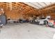 Spacious garage with ample room for vehicles, motorcycles, and a workshop area, enhancing the property's appeal at 13640 County Road 182, Bennett, CO 80102