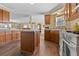 Spacious kitchen featuring wood cabinets, ample counter space, and an open layout with great natural light at 13640 County Road 182, Bennett, CO 80102