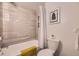Clean bathroom features shower over tub and tiled walls at 937 N Clarkson St # 405, Denver, CO 80218