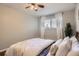 Bright bedroom with a window and a ceiling fan, creating a comfortable and airy space at 937 N Clarkson St # 405, Denver, CO 80218