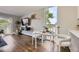 Bright dining area and balcony view at 937 N Clarkson St # 405, Denver, CO 80218