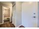 Hallway view featuring entry and bath with updated tile surround at 937 N Clarkson St # 405, Denver, CO 80218