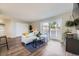 Bright living room with balcony access at 937 N Clarkson St # 405, Denver, CO 80218